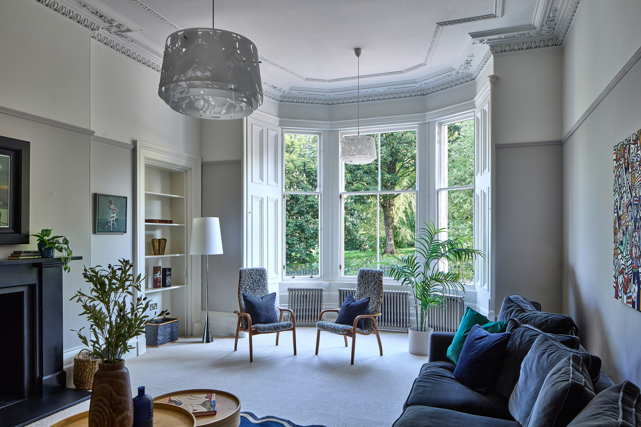 Living room seating beneath a bay window