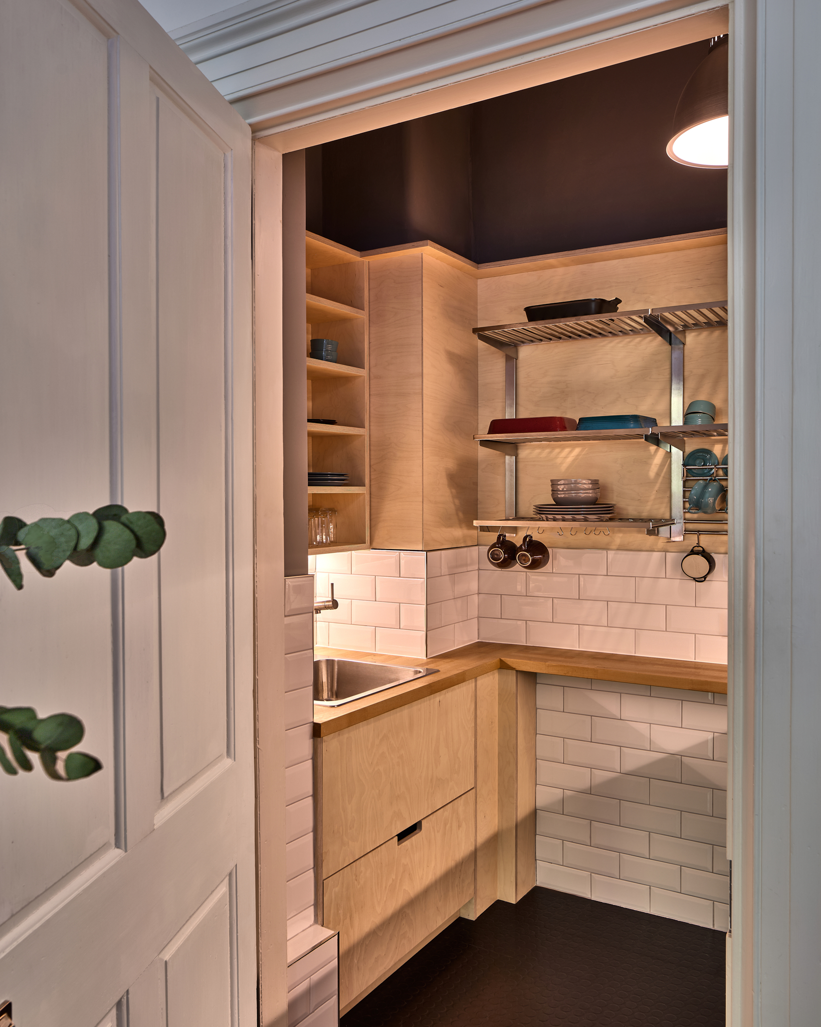 Dark timber kitchen units with open shelving