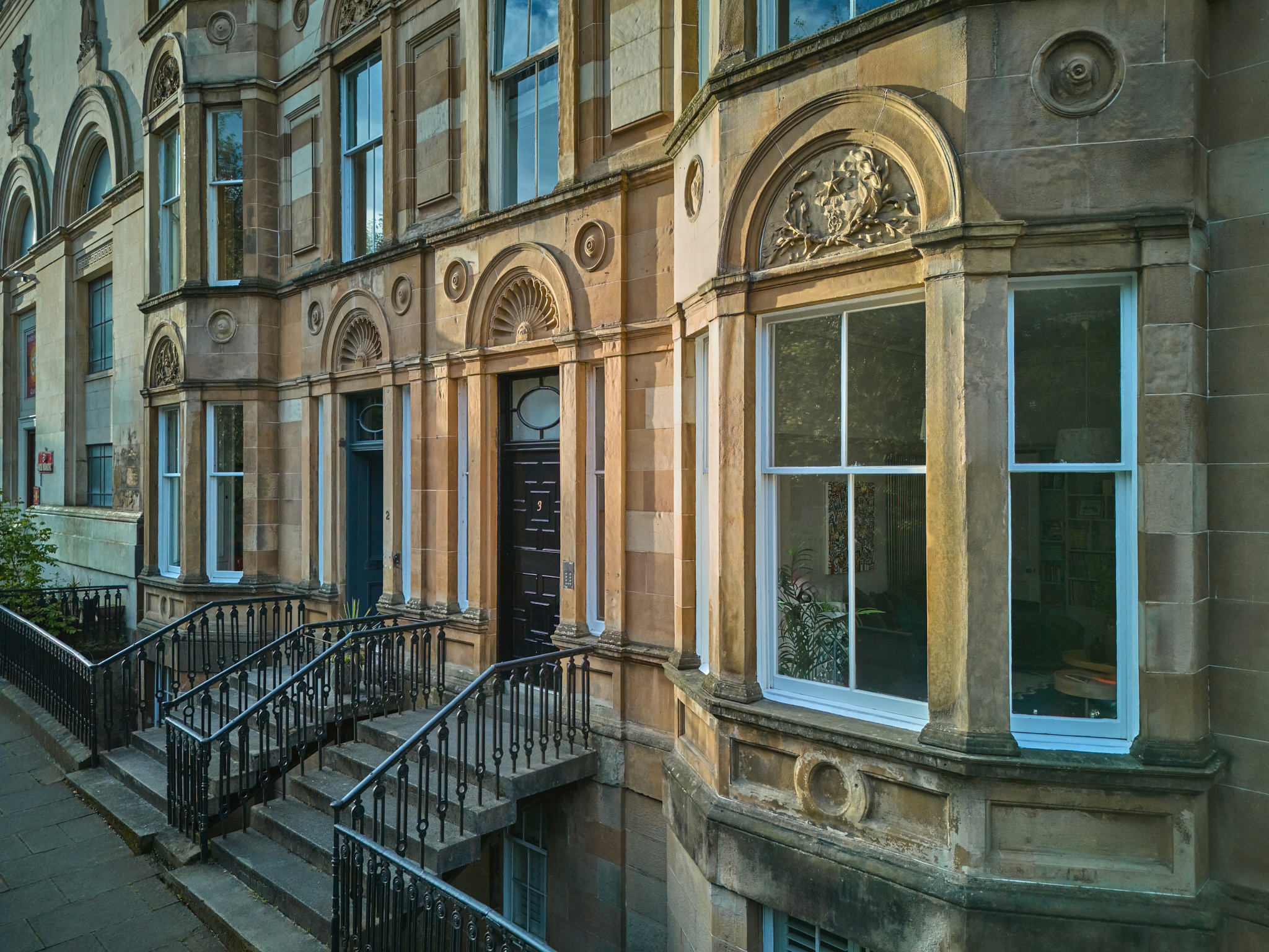 Sandstone terrace exterior with original bay windows